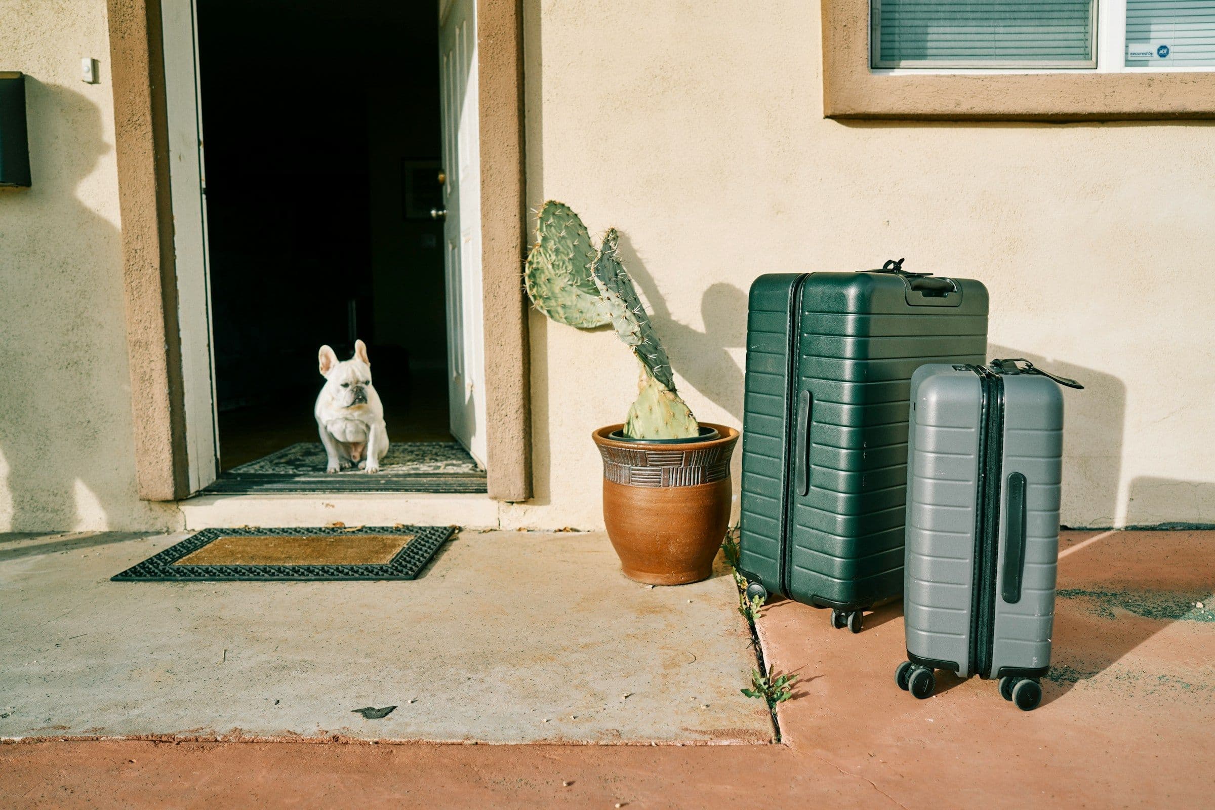 Suitcase at the front door of a holiday apartment at check-out